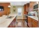 Charming kitchen featuring wood cabinets, countertops, stainless steel appliances, and a sink with a modern faucet at 2665 S Pennsylvania St, Denver, CO 80210