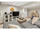 Spacious living room featuring a large television and decorative accents at 2665 S Pennsylvania St, Denver, CO 80210