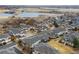 Aerial view showcasing community with pond, golf course, and well-maintained landscaping at 3000 E 112 Ave # 102, Northglenn, CO 80233