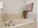 Close up of the bathtub with silver fixtures, candles and decorative vase at 3000 E 112 Ave # 102, Northglenn, CO 80233