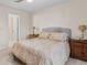 Primary bedroom with carpet, ceiling fan, and a view to the hall at 3000 E 112 Ave # 102, Northglenn, CO 80233