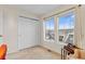 Bedroom with ample natural light, closet with sliding doors, and views of the neighborhood at 3000 E 112 Ave # 102, Northglenn, CO 80233