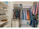 Walk-in closet with built-in shelving and clothing racks for optimal storage at 3000 E 112 Ave # 102, Northglenn, CO 80233