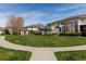 View of a community with manicured lawns and multi-Gathering residences at 3000 E 112 Ave # 102, Northglenn, CO 80233