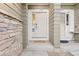 Charming entryway with a secure front door and stone accents, creating a warm welcome at 3000 E 112 Ave # 102, Northglenn, CO 80233