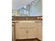 Kitchen featuring a farmhouse sink, white cabinets, stainless steel appliances, and mosaic tile backsplash at 3000 E 112 Ave # 102, Northglenn, CO 80233
