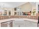 Bright kitchen with granite counters, stainless steel appliances, and designer backsplash detail at 3000 E 112 Ave # 102, Northglenn, CO 80233