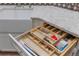 Kitchen detail of modern drawer system, white cabinets and countertops at 3000 E 112 Ave # 102, Northglenn, CO 80233
