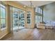 Bright living room featuring hardwood floors, fireplace, and large windows with backyard views at 3000 E 112 Ave # 102, Northglenn, CO 80233