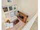 Elevated view of the living room with high ceilings, large windows, and comfortable seating arrangement at 3000 E 112 Ave # 102, Northglenn, CO 80233