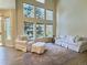 Bright living room with large windows and comfortable white seating arrangements at 3000 E 112 Ave # 102, Northglenn, CO 80233