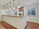 Basement kitchenette with granite countertop at 9562 Silent Hills Ln, Lone Tree, CO 80124