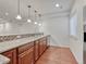 Basement kitchen with wood cabinets and granite at 9562 Silent Hills Ln, Lone Tree, CO 80124