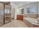 Spa-like bathroom with soaking tub, walk-in shower, and double vanity at 9562 Silent Hills Ln, Lone Tree, CO 80124