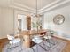 Spacious dining room with an oval wooden table and chandelier at 9562 Silent Hills Ln, Lone Tree, CO 80124