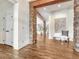 Bright entryway with hardwood floors and stone pillars at 9562 Silent Hills Ln, Lone Tree, CO 80124