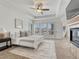 Bright and airy main bedroom with large windows and a ceiling fan at 9562 Silent Hills Ln, Lone Tree, CO 80124