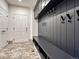 Mudroom with built-in bench and storage at 9562 Silent Hills Ln, Lone Tree, CO 80124