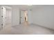 Bright bedroom with neutral carpet and a large walk-in closet provides plenty of storage at 2998 S Adams St, Denver, CO 80210