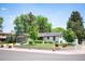 Well-maintained home with lush landscaping, a new garage door, and a inviting curb appeal at 2998 S Adams St, Denver, CO 80210
