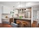 Modern kitchen featuring a center island with barstool seating, stainless steel appliances, and sleek cabinetry at 2998 S Adams St, Denver, CO 80210
