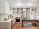 Modern kitchen featuring stainless steel appliances, sleek cabinetry, and a stylish island at 2998 S Adams St, Denver, CO 80210