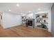 Spacious living room with wood floors, built-in shelves, and a cozy fireplace at 2998 S Adams St, Denver, CO 80210