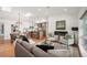 Open concept living space with hardwood floors, fireplace, skylights, and modern kitchen at 2998 S Adams St, Denver, CO 80210