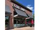 Exterior view of Osteria Alberico restaurant with outdoor seating and awnings at 2998 S Adams St, Denver, CO 80210