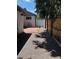 Side yard with gravel landscaping leading to the back gate at 2998 S Adams St, Denver, CO 80210