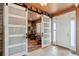 Inviting entryway featuring stylish sliding barn doors, modern decor, and lots of natural light at 2345 Tavern Way, Castle Rock, CO 80104