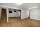 Large, open basement with access to stairs offers flexible living and storage at 16215 E Brunswick Dr, Aurora, CO 80013