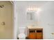 Simple bathroom featuring shower, toilet, vanity and tiled walls at 16215 E Brunswick Dr, Aurora, CO 80013
