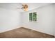 Bedroom with carpet, a modern ceiling fan, and a bright window at 16215 E Brunswick Dr, Aurora, CO 80013