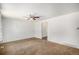 View of living room featuring neutral walls, carpet, and ceiling fan at 16215 E Brunswick Dr, Aurora, CO 80013