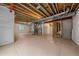 Unfinished basement featuring exposed beams, concrete flooring, and open space for customization at 8268 Mt Harvard Rd, Littleton, CO 80125