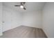 Clean bedroom featuring a ceiling fan, neutral carpet, and a white door at 8268 Mt Harvard Rd, Littleton, CO 80125