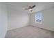 Bright bedroom with ceiling fan, carpeted floor, and a window with blinds at 8268 Mt Harvard Rd, Littleton, CO 80125