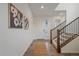 Bright entryway with a staircase, wooden floors, and modern art at 8268 Mt Harvard Rd, Littleton, CO 80125