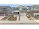 Inviting two-story home with stone accents, well-kept front yard and two-car garage at 8268 Mt Harvard Rd, Littleton, CO 80125