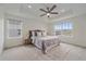 Light and airy bedroom with large windows, tray ceilings, a ceiling fan, and a neutral color scheme at 8268 Mt Harvard Rd, Littleton, CO 80125