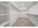 Well-organized walk-in closet with shelves and rods for ample storage space at 8268 Mt Harvard Rd, Littleton, CO 80125