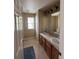 Bathroom featuring dual sinks, tile floors and a linen closet at 9616 Nucla St, Commerce City, CO 80022