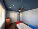 Cozy bedroom with celestial ceiling design and ceiling fan providing a fun and relaxing space at 9616 Nucla St, Commerce City, CO 80022