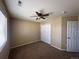Bedroom with neutral walls, plush carpet, and a closet for storage at 9616 Nucla St, Commerce City, CO 80022