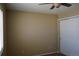 Bedroom with neutral walls, plush carpet, ceiling fan, and a window for natural light at 9616 Nucla St, Commerce City, CO 80022