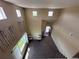 Open entryway with tall ceilings, neutral walls, and natural light from multiple windows at 9616 Nucla St, Commerce City, CO 80022