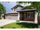 Charming two-story home with a three car garage and a well-manicured front lawn at 9616 Nucla St, Commerce City, CO 80022