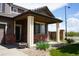 Charming front porch with stone and brick accents and meticulously landscaped front yard at 9616 Nucla St, Commerce City, CO 80022