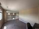 Bright loft area featuring neutral walls, carpeted floors, and natural light from the windows at 9616 Nucla St, Commerce City, CO 80022